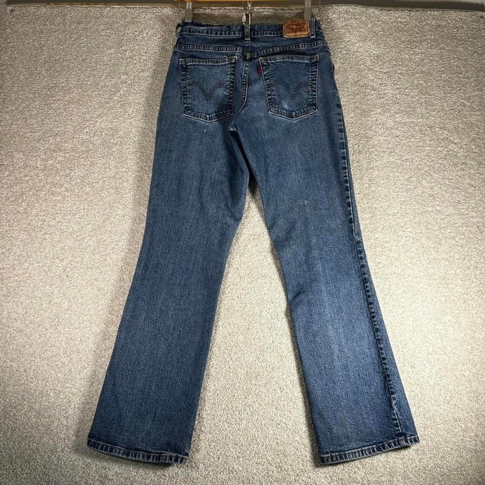 Y2K women's Levi's 550 low rise bootcut blue distressed denim jeans pants